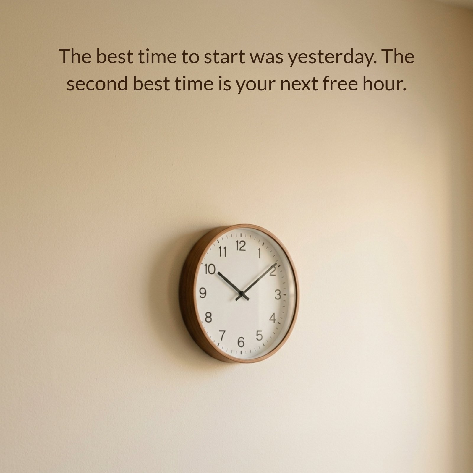 A minimalist photo of a wall clock with text on it: “The best time to start was yesterday. The second best time is your next free hour."