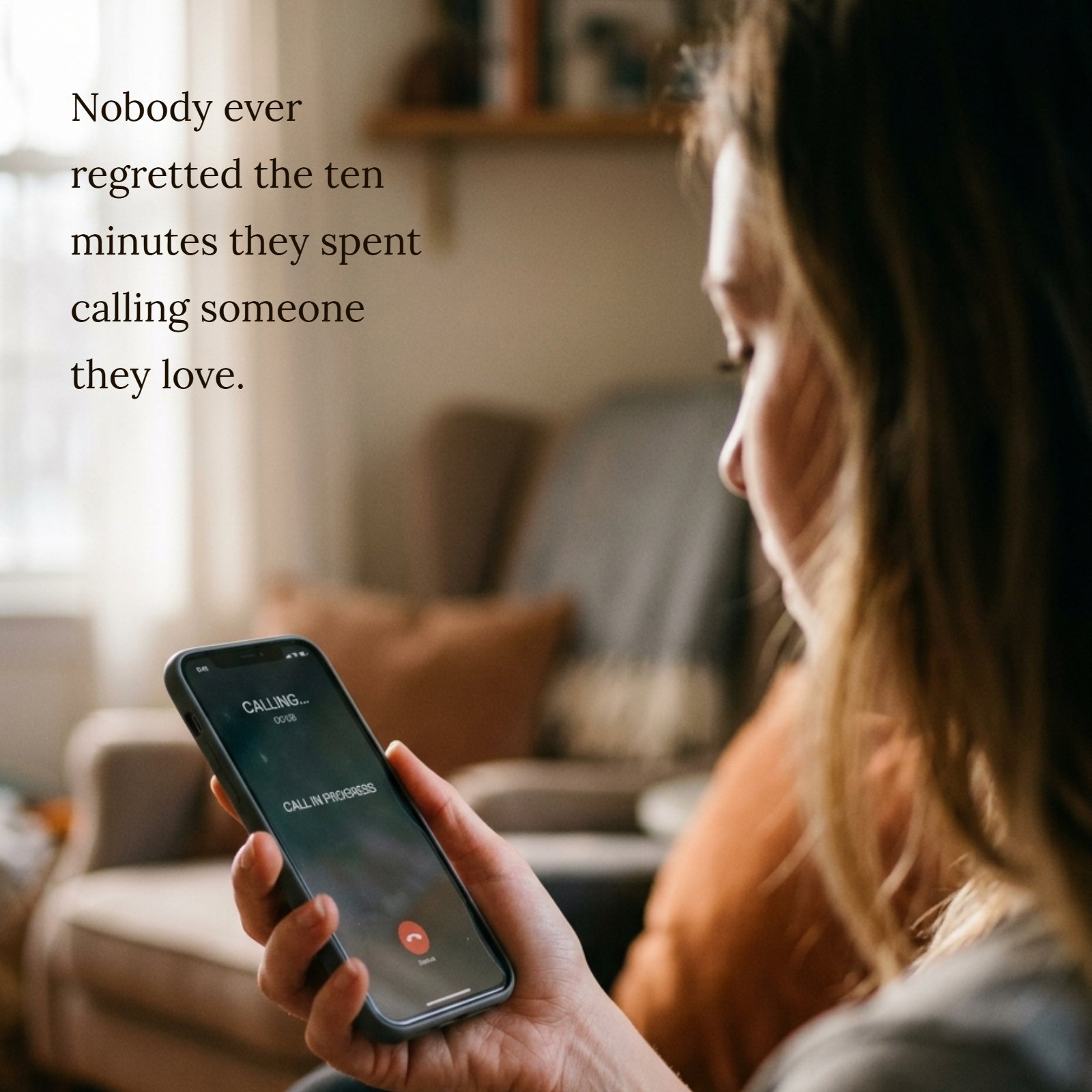 A person holding a smartphone to their ear, talking, with a warm, natural window light falling on them. The text overlaid says "Nobody ever regretted the ten minutes they spent calling someone they love."