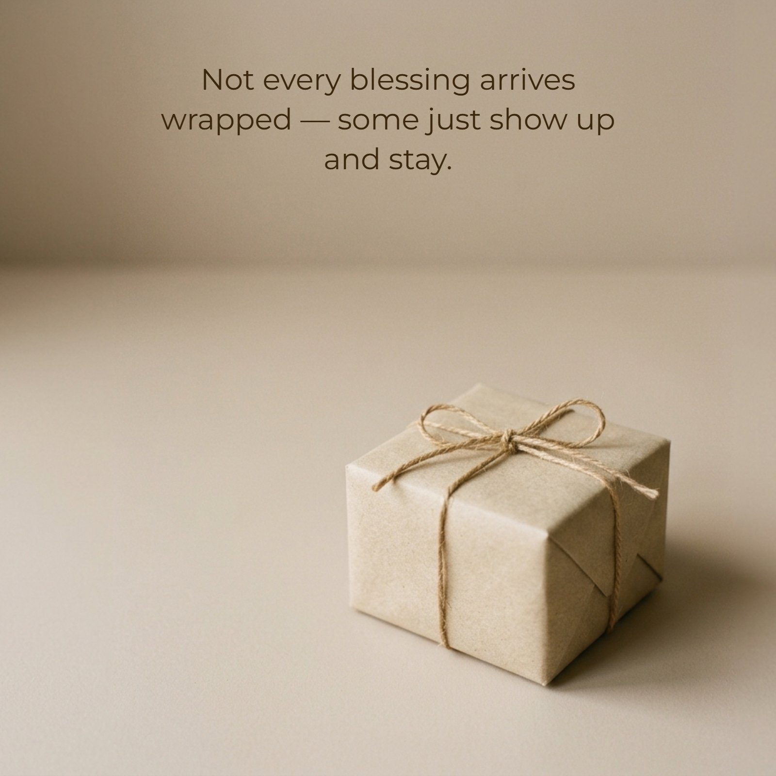 A vertical minimalist photograph of a craft paper gift box on a beige surface with the Friends quote ‘Not every blessing arrives wrapped — some just show up and stay’ overlaid in delicate font.
