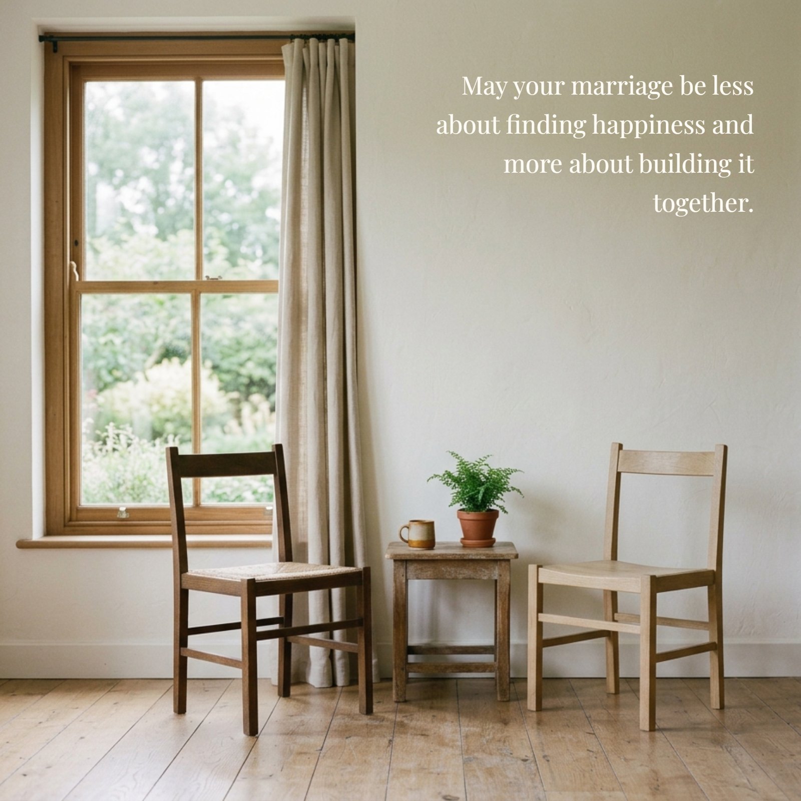 A minimalist photograph of two plain wooden chairs facing each other by a sunlit window, with the quote 'May your marriage be less about finding happiness and more about building it together' overlaid in elegant typography.