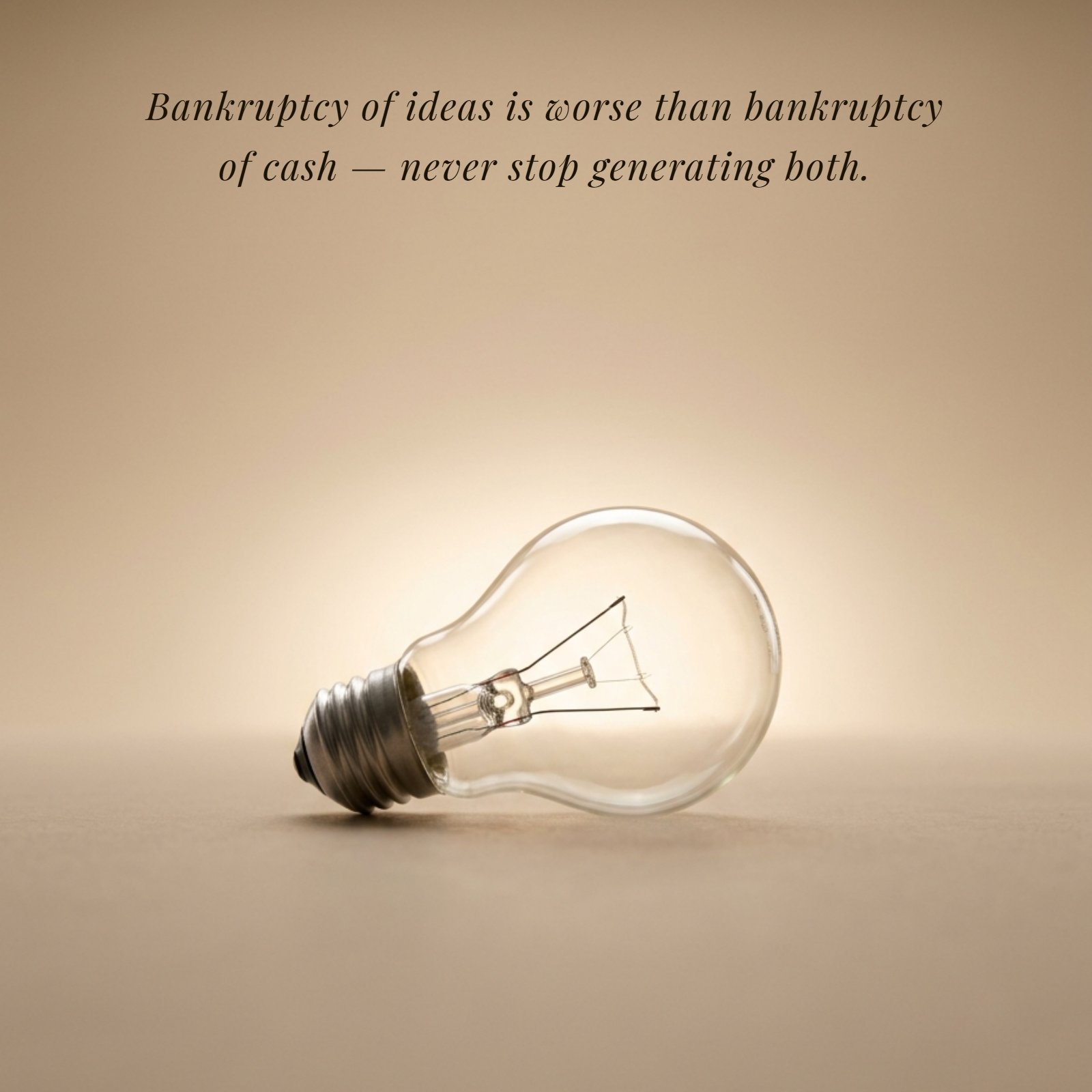 Minimalist 1:1 square photo of a lightbulb on a plain surface with soft warm backlight. Below the image is the text of the quote: 'Bankruptcy of ideas is worse than bankruptcy of cash — never stop generating both.'