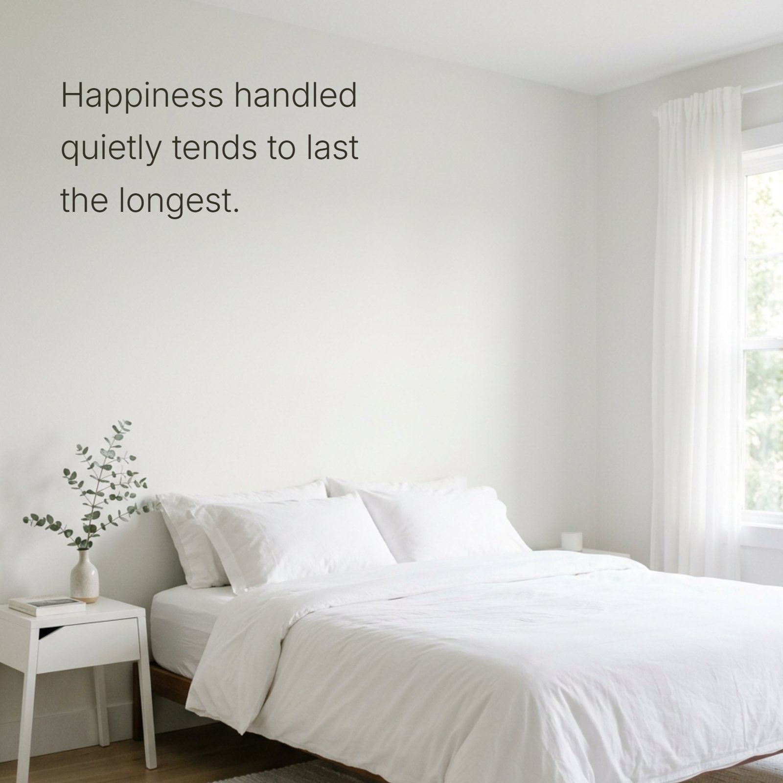 Minimalist bright bedroom with soft morning light and white linens, featuring the quote "Happiness handled quietly tends to last the longest."