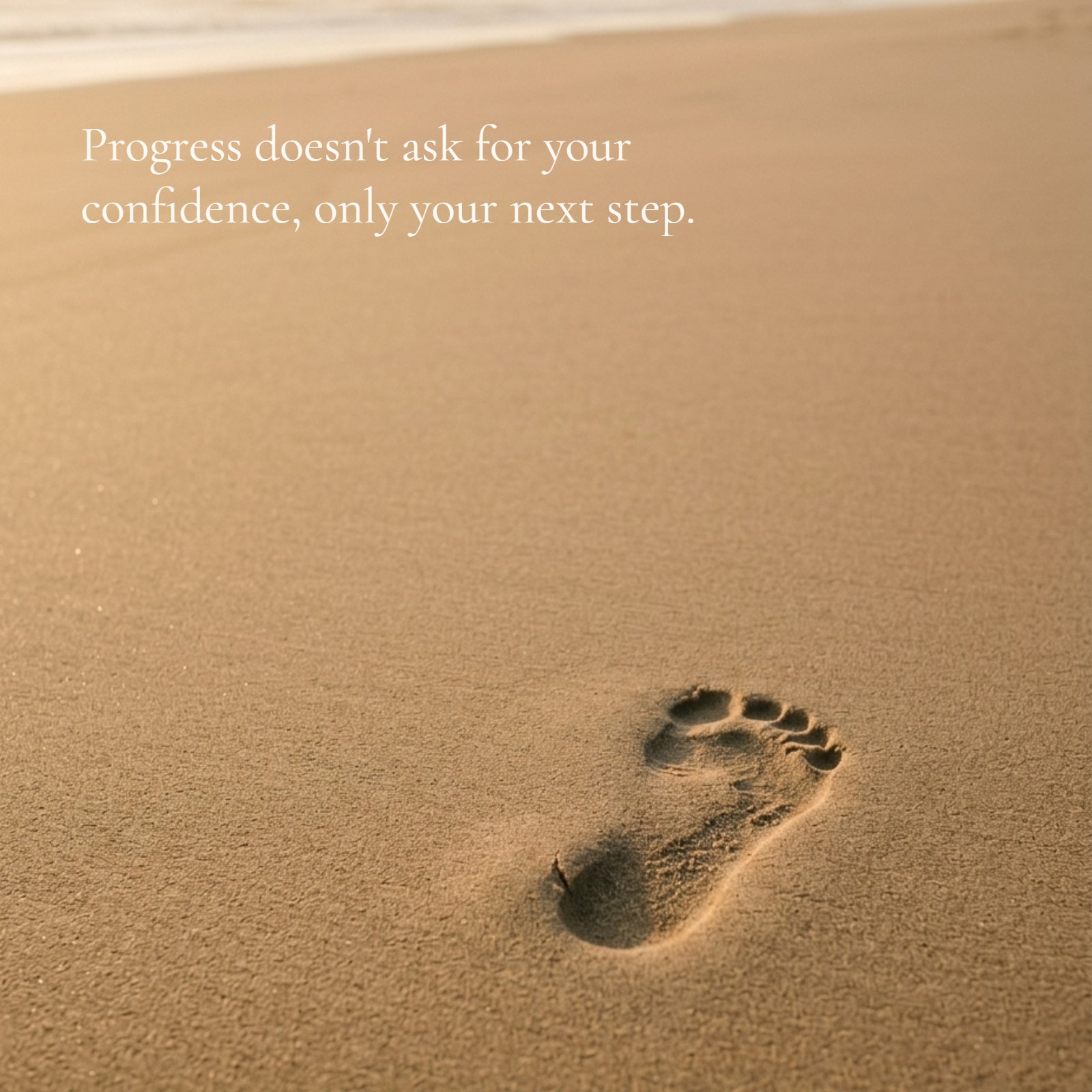 A single footprint in soft, golden beach sand, positioned in the lower third, with a motivational quote overlaid in white serif text: "Progress doesn't ask for your confidence, only your next step." The upper image is clean.