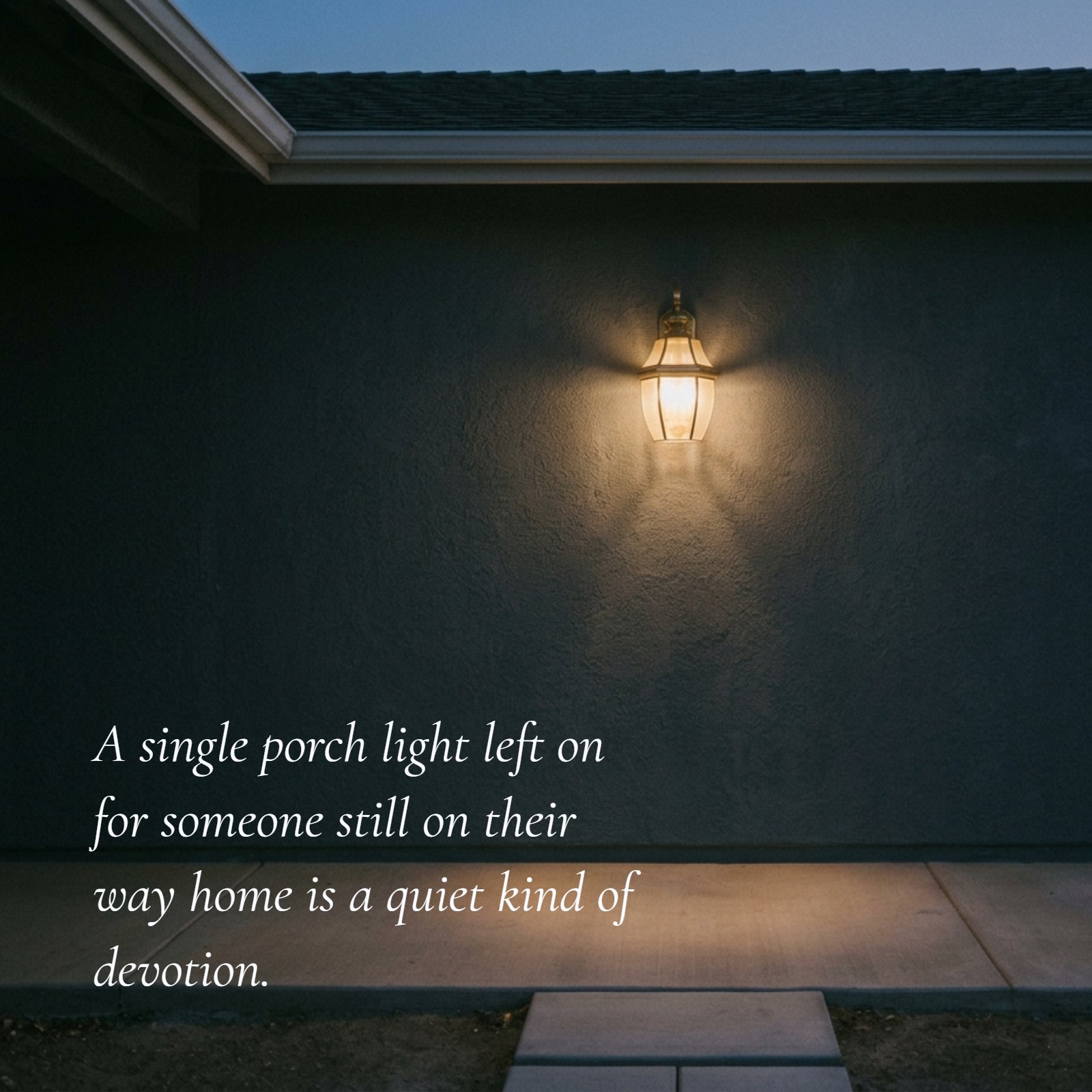 A minimalist photo of a warm, glowing porch light against a dark wall, with the text overlay 'A single porch light left on for someone still on their way home is a quiet kind of devotion.'