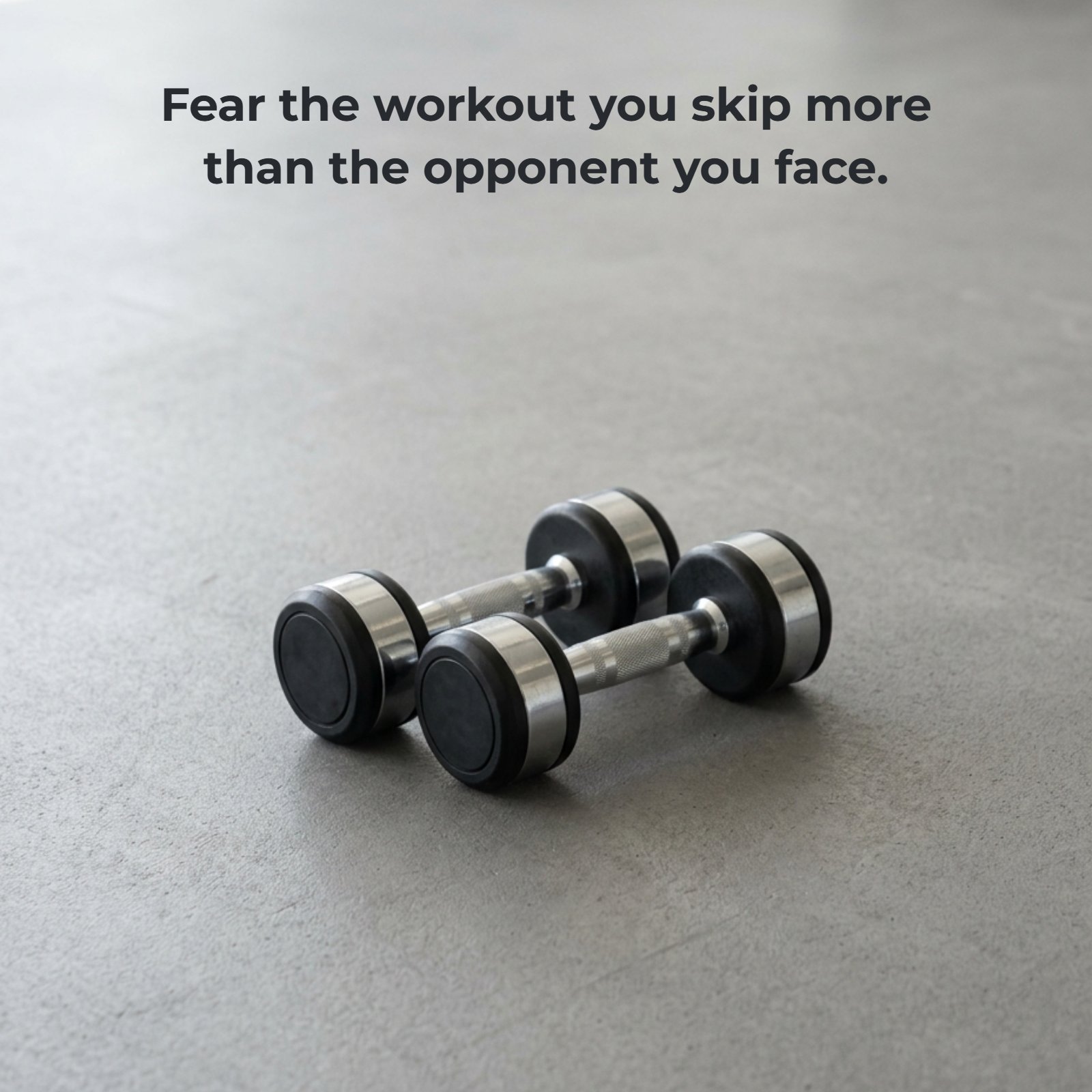 Minimalist image of dumbbells on a gym floor with text overlay reading "Fear the workout you skip more than the opponent you face."