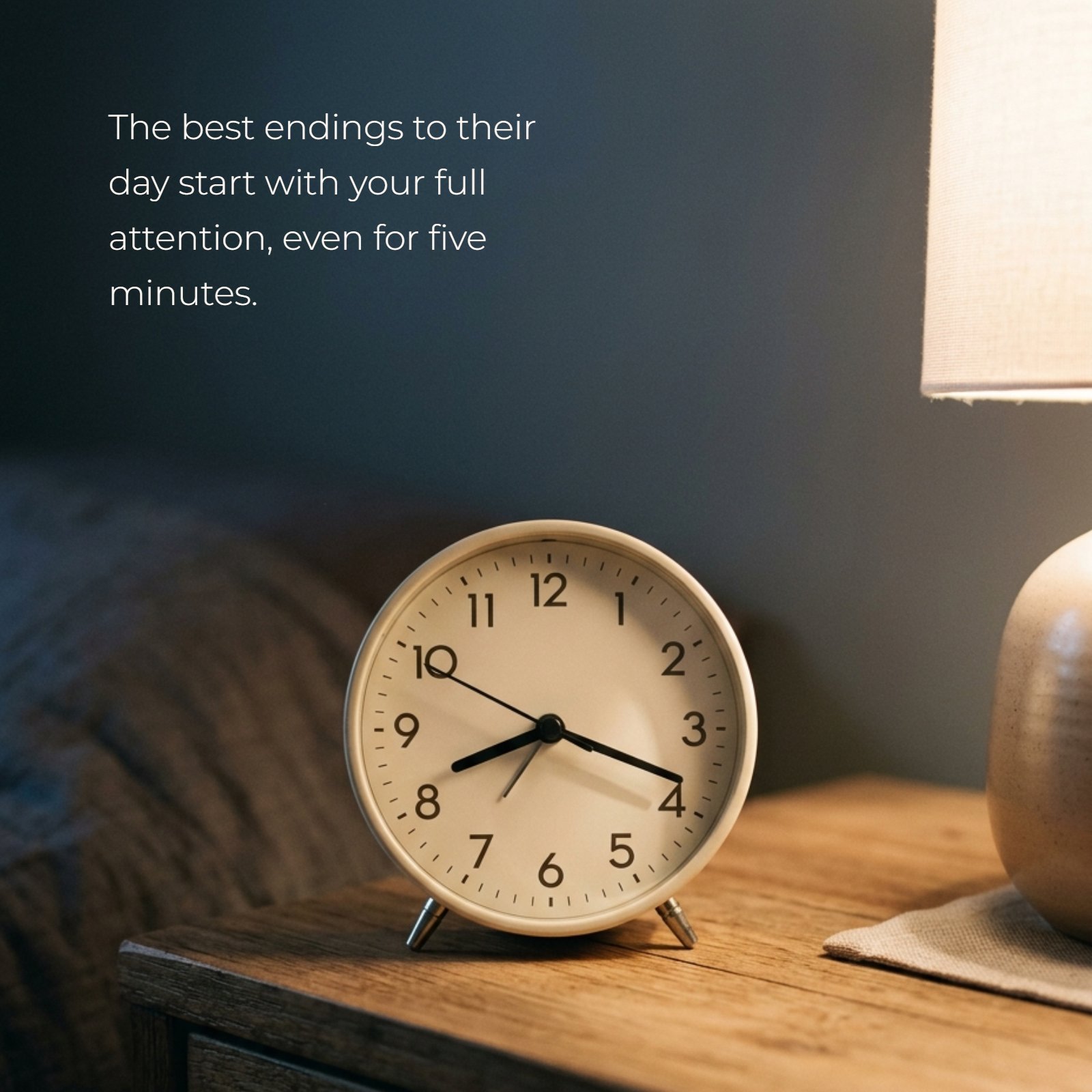 Minimalist evening photograph of a nightstand with an analog clock showing approximately 8:20, glowing with warm light. An inspiring parenting quote about giving children full attention is written on it.
