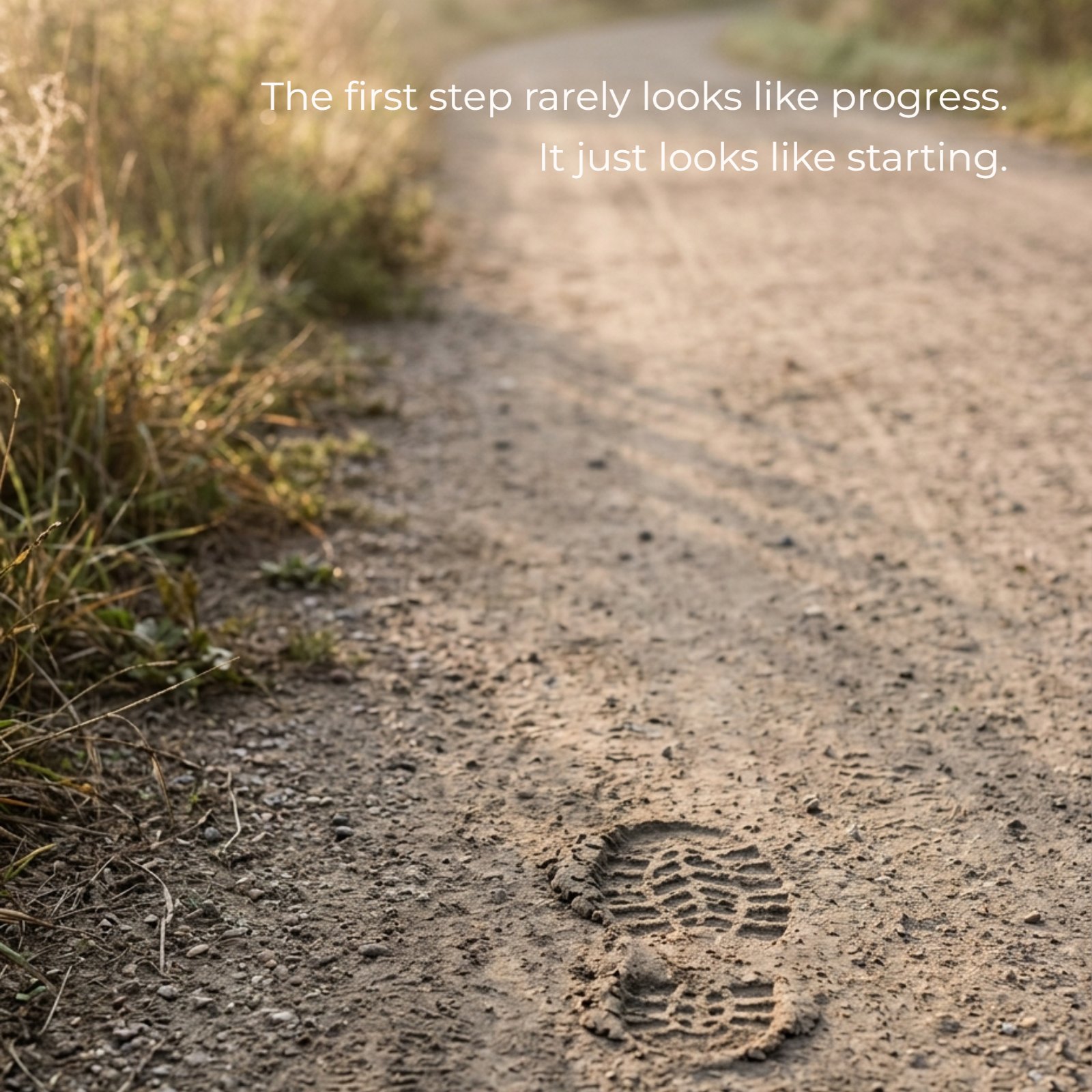 Minimalist image of a solitary footprint on a dusty path at sunrise. Overlaid text reads: The first step rarely looks like progress. It just looks like starting.