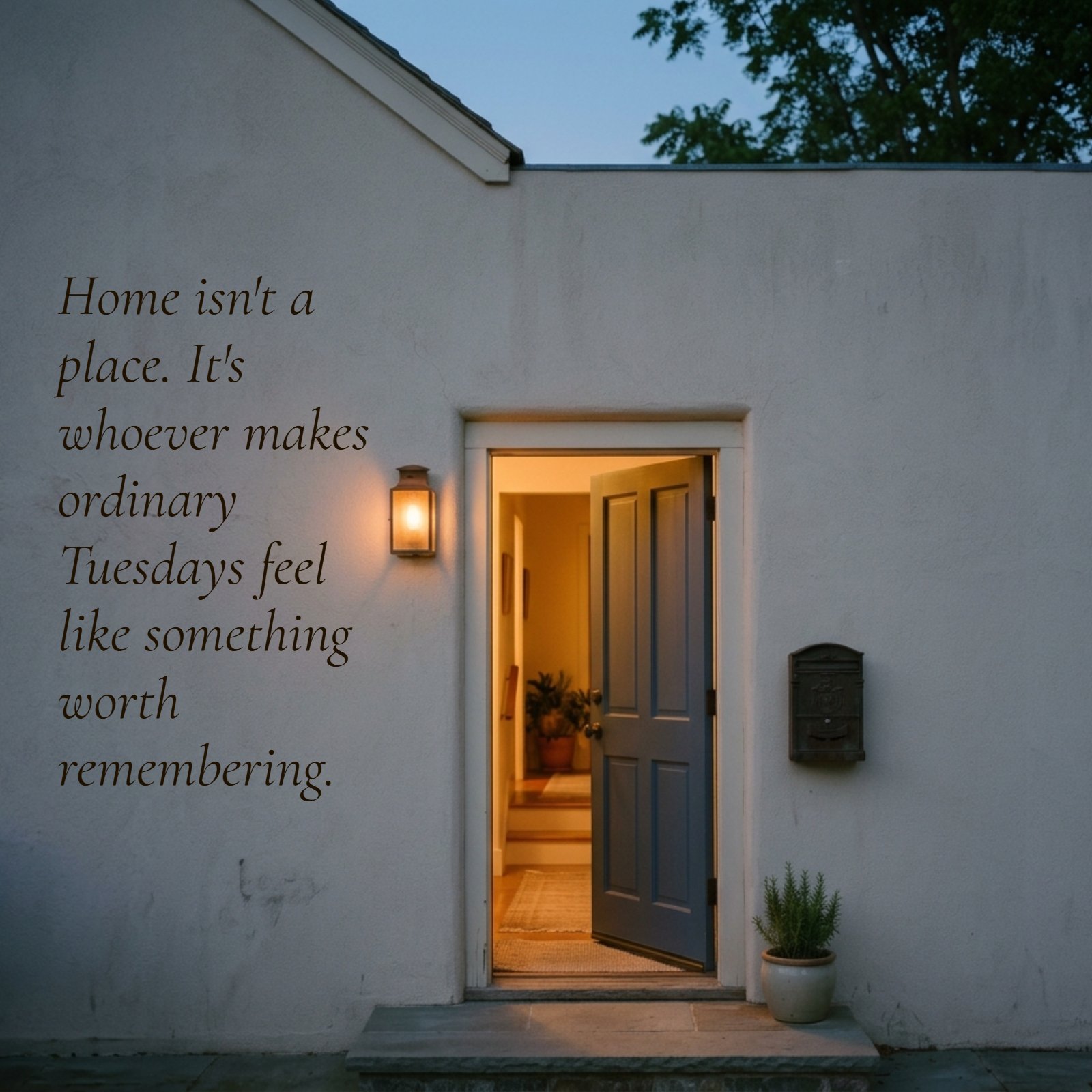 Minimalist dusk photograph featuring a warmly lit, open doorway in a plain, textured exterior wall. The image provides ample clean negative space to overlay the quote, "Home isn't a place. It's whoever makes ordinary Tuesdays feel like something worth remembering."