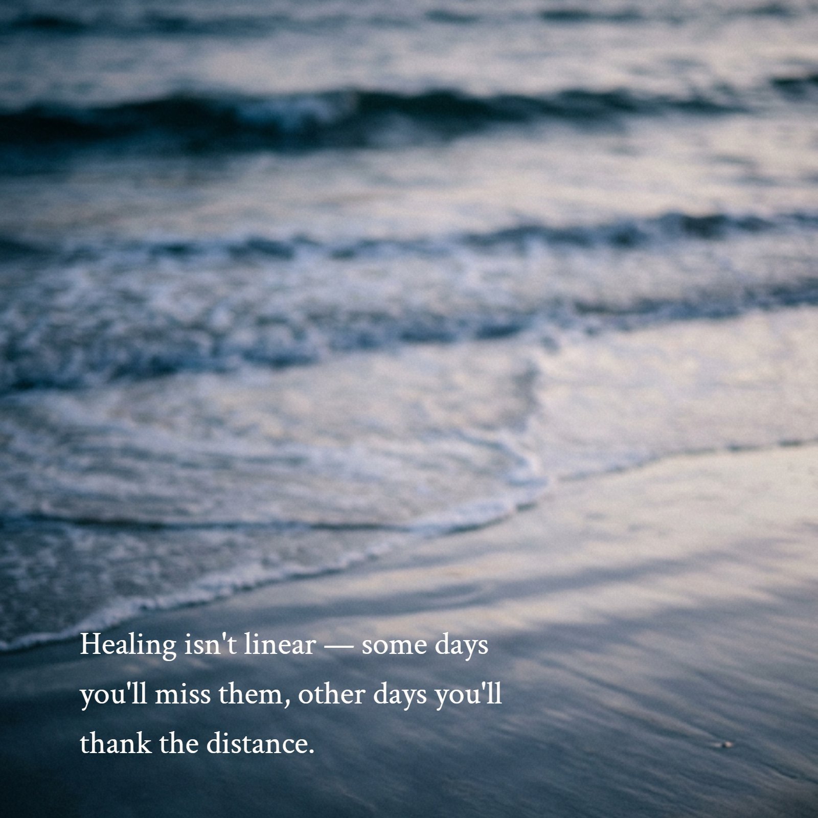 A blurred photograph of ocean waves gently receding from the shore at dusk, in muted blue and grey tones, creating a calm, reflective mood.