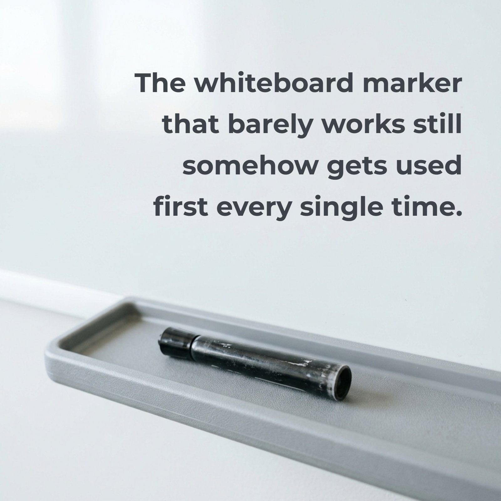 Minimalist photo of a single dry-erase marker resting on a plain classroom tray, used as a backdrop for the quote, “The whiteboard marker that barely works still somehow gets used first every single time.”