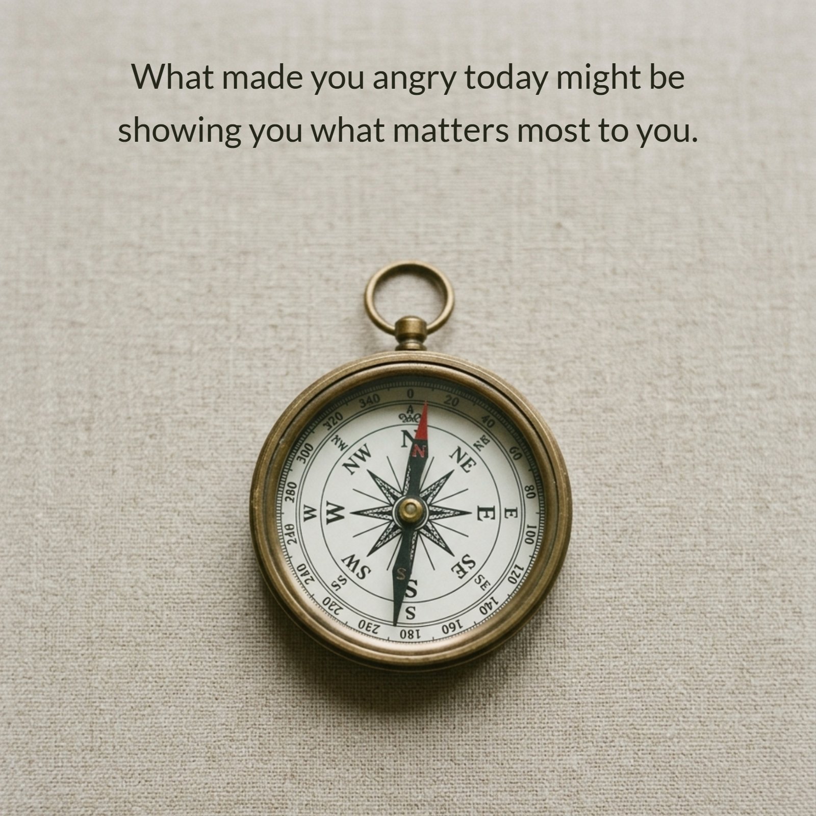 A vintage brass compass centered on a textured beige fabric background, symbolizing finding your way. Below it, the quote “What made you angry today might be showing you what matters most to you.” is centered in a classic serif font.