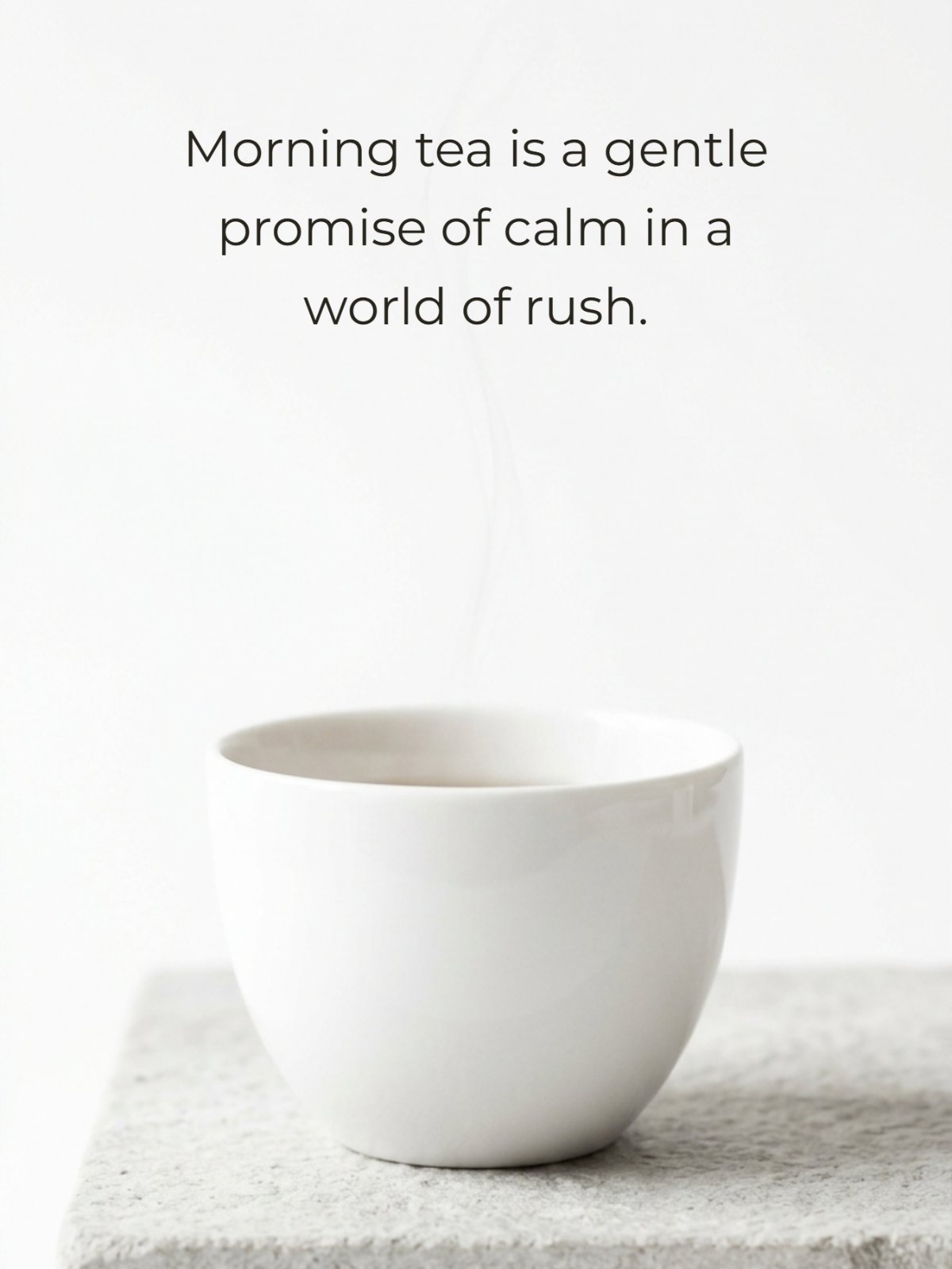 A white handleless teacup rests on a grey stone slab against a white background with subtle steam rising. Below the cup, the quote text reads: 'Morning tea is a gentle promise of calm in a world of rush.'