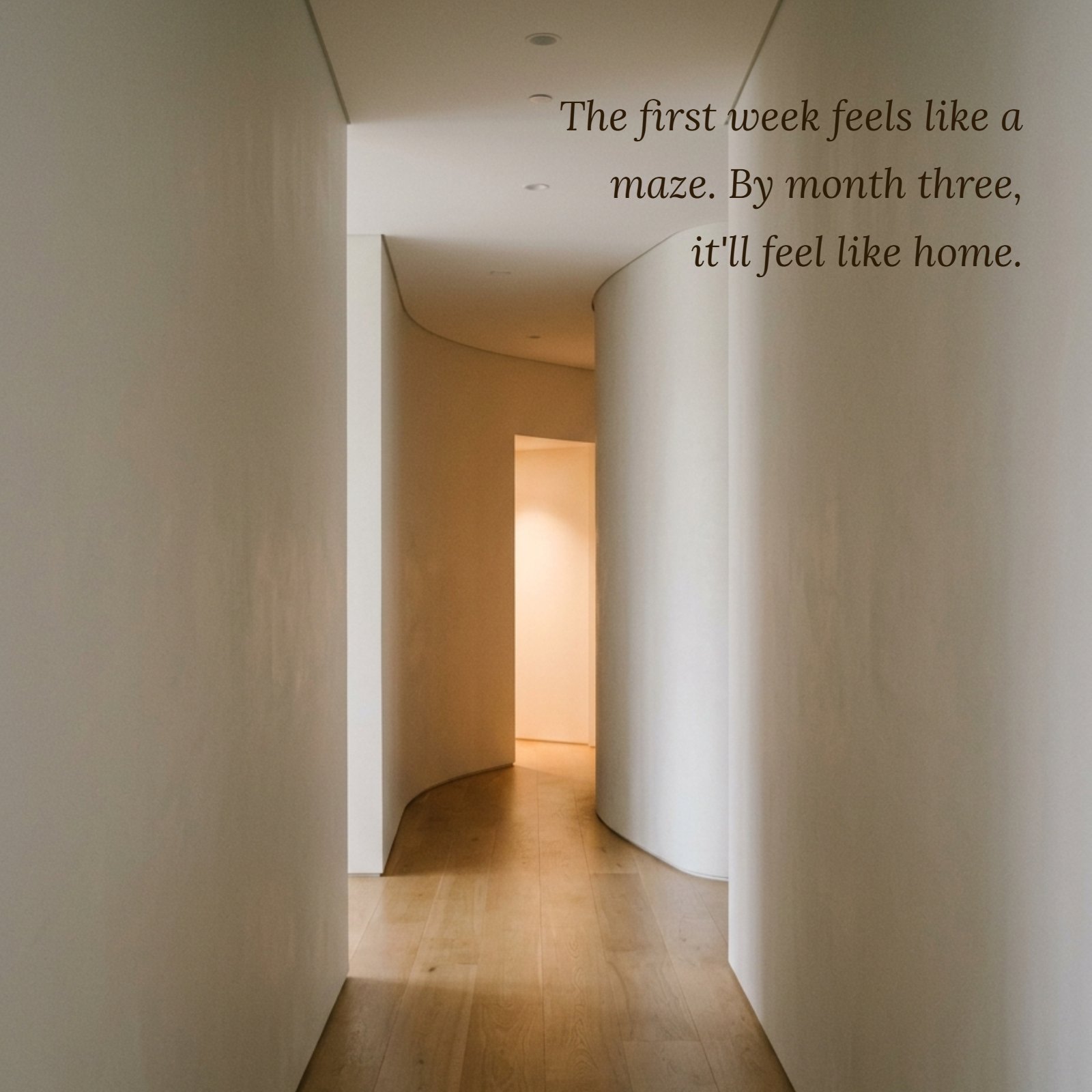 A minimalist photo of a curved, modern hallway with neutral walls and a wooden floor, leading toward a soft, warm light at the end, symbolizing the journey described in the new job quote.